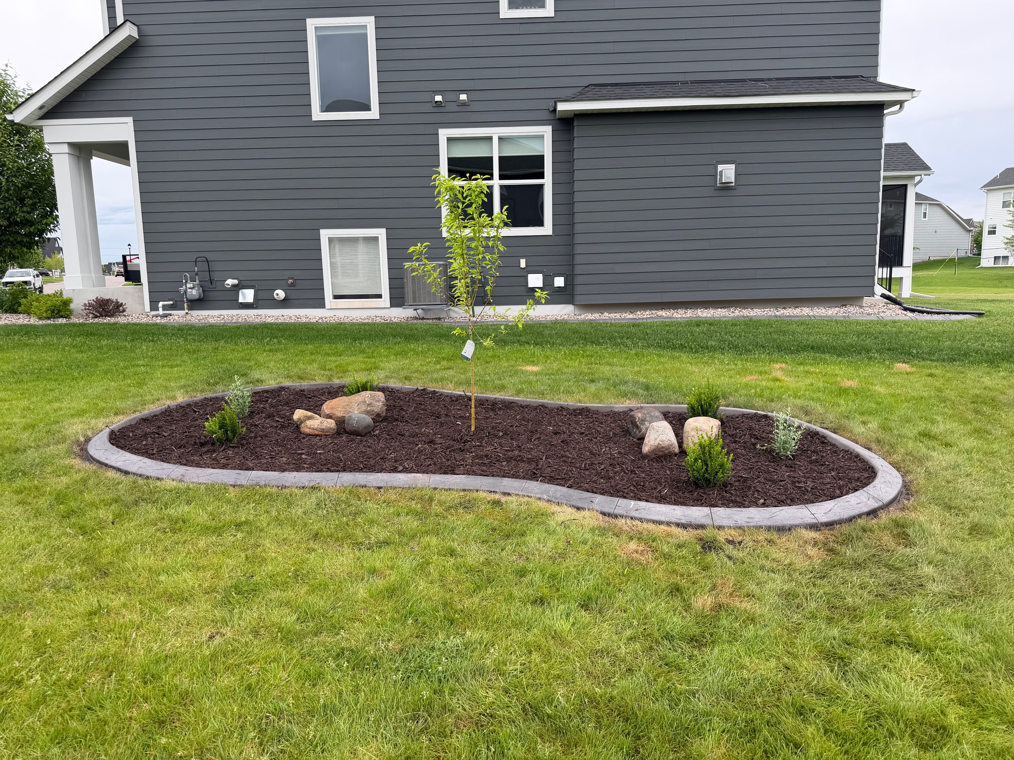 Project Concrete Curbing and Mulch Beds Done Right in Maple Grove image