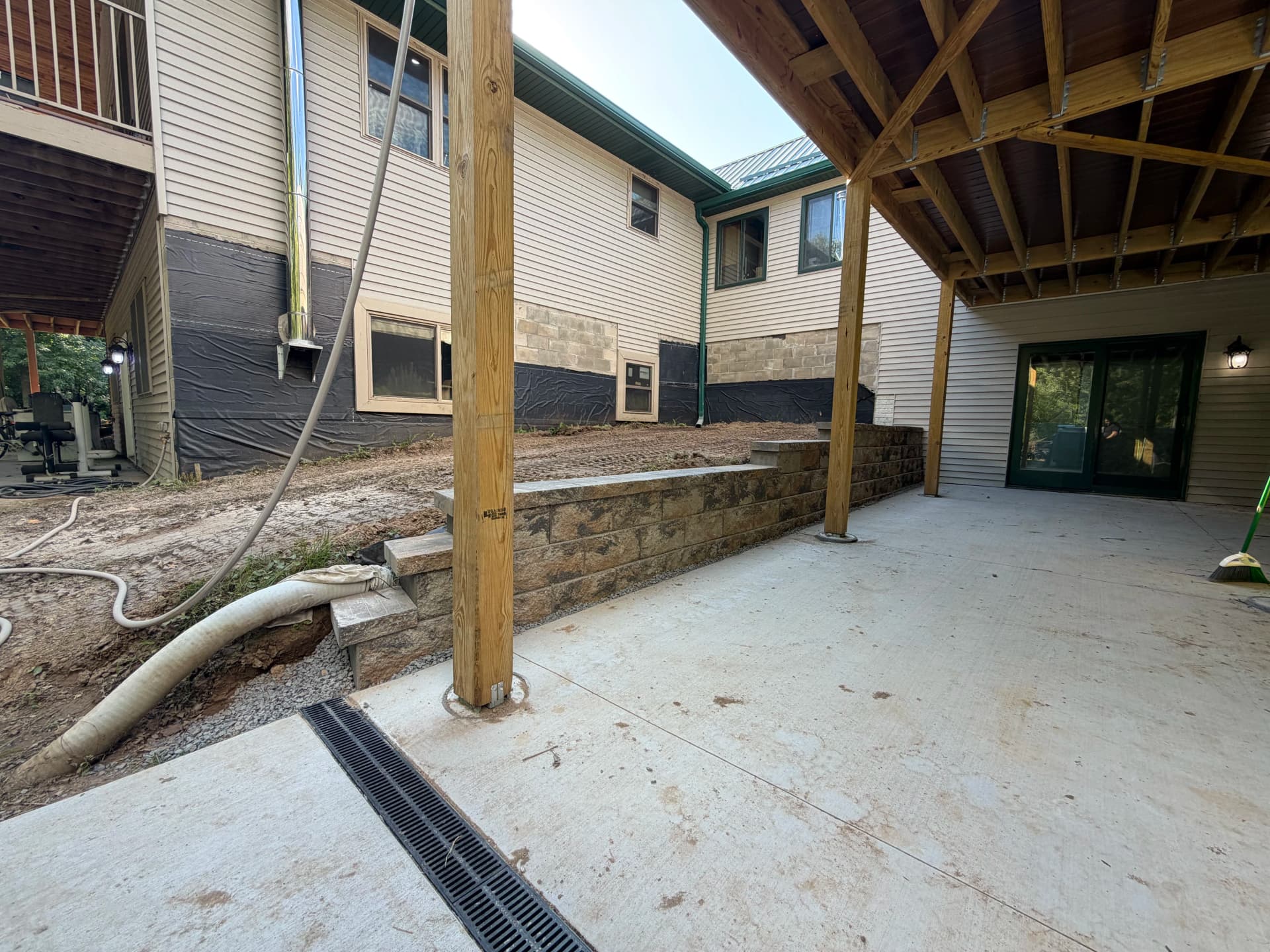Old Retaining Walls Replaced With Two Solid New Ones Around Pool and Patio