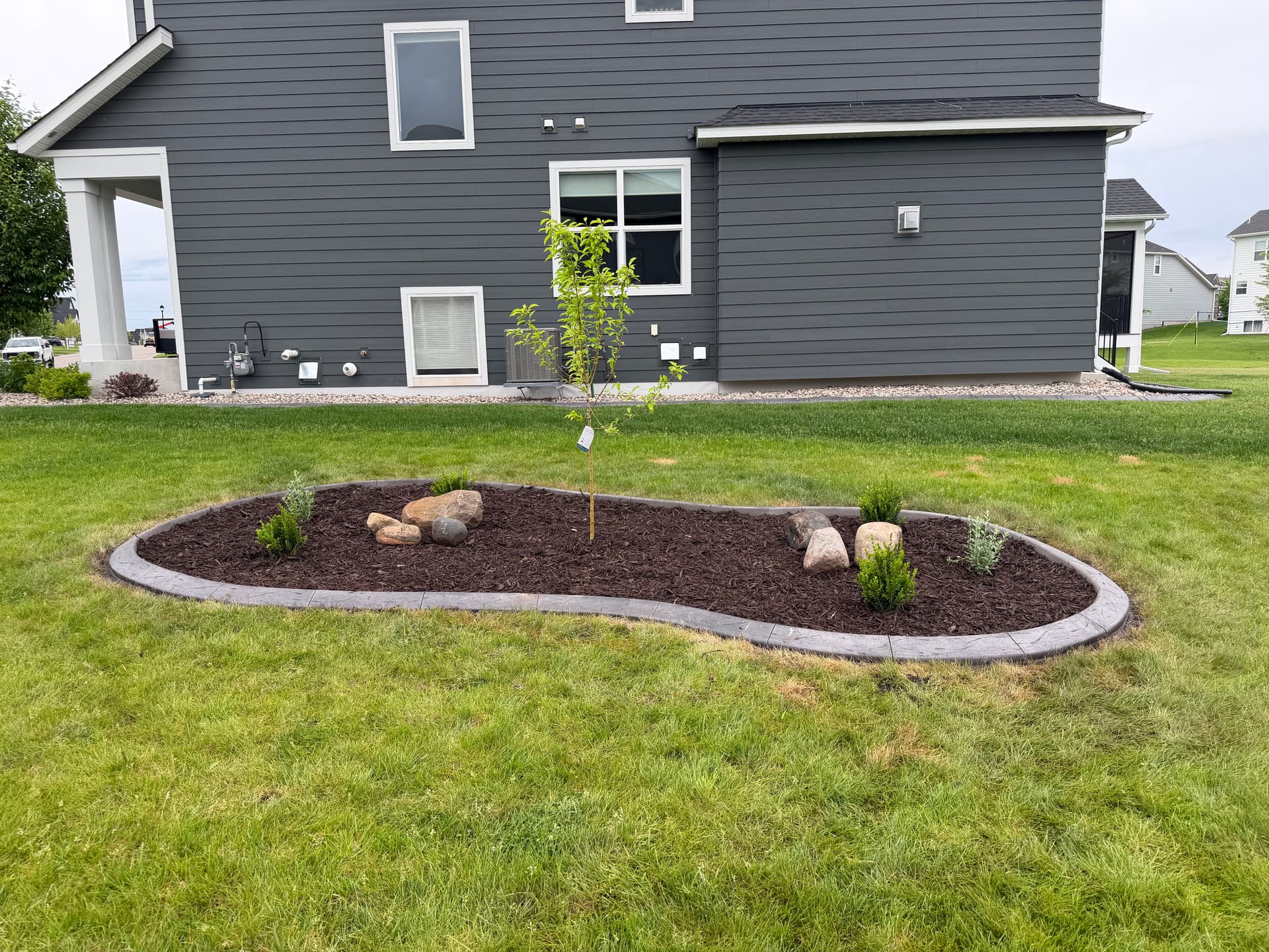 Concrete Curbing and Mulch Beds Done Right in Maple Grove image